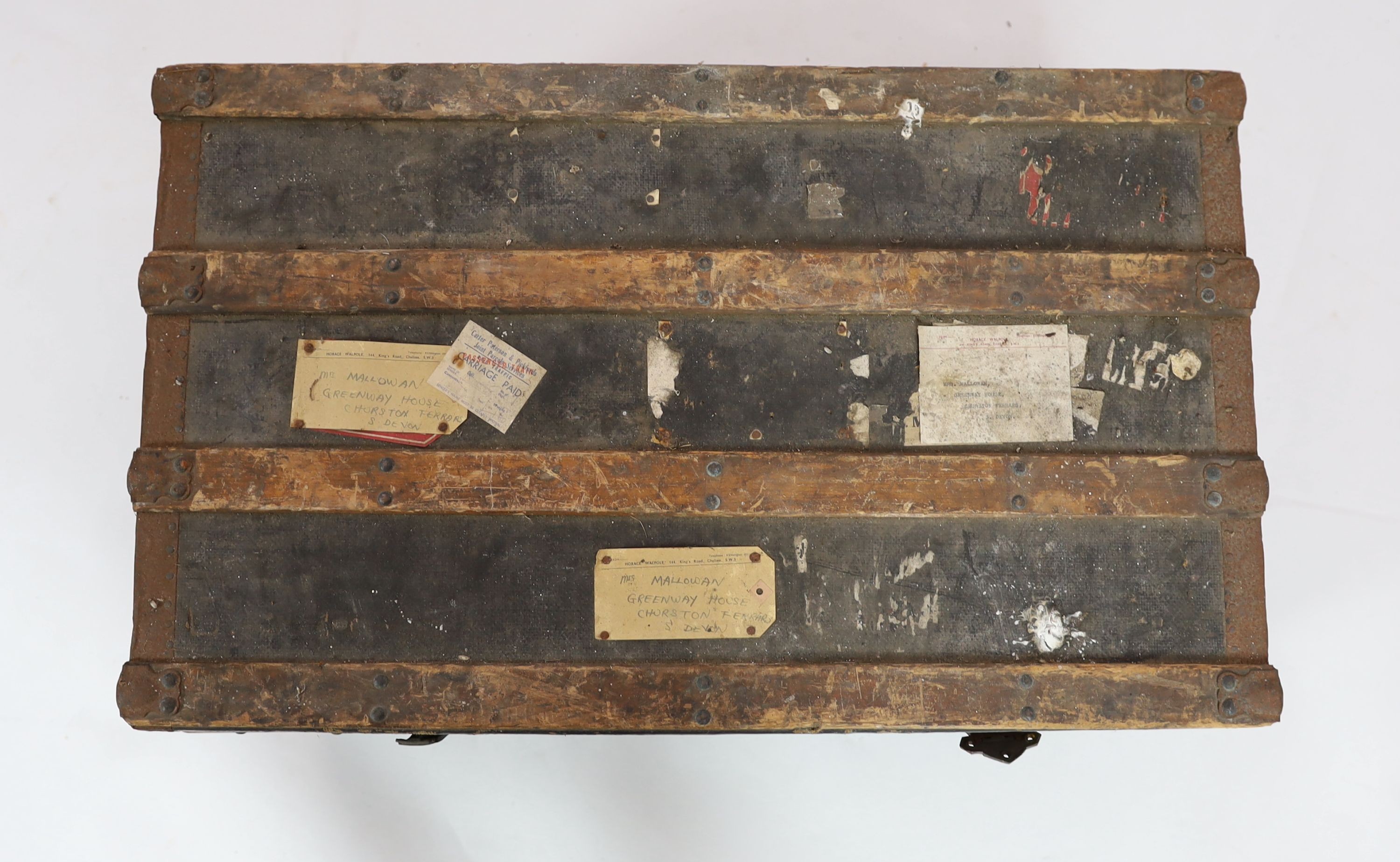 A metal mounted canvas and wood bound cabin trunk, bearing labels relating to 'Mrs Mallowan', 84cm wide